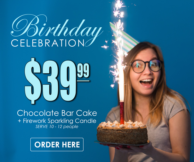 Girl holding a birthday cake with firework candle